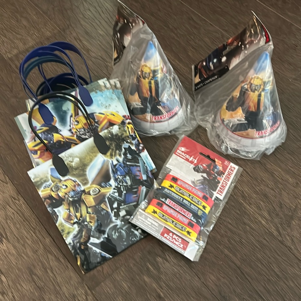 Lot of transformers birthday party items.